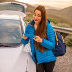 Woman traveling by car on the mountain road
